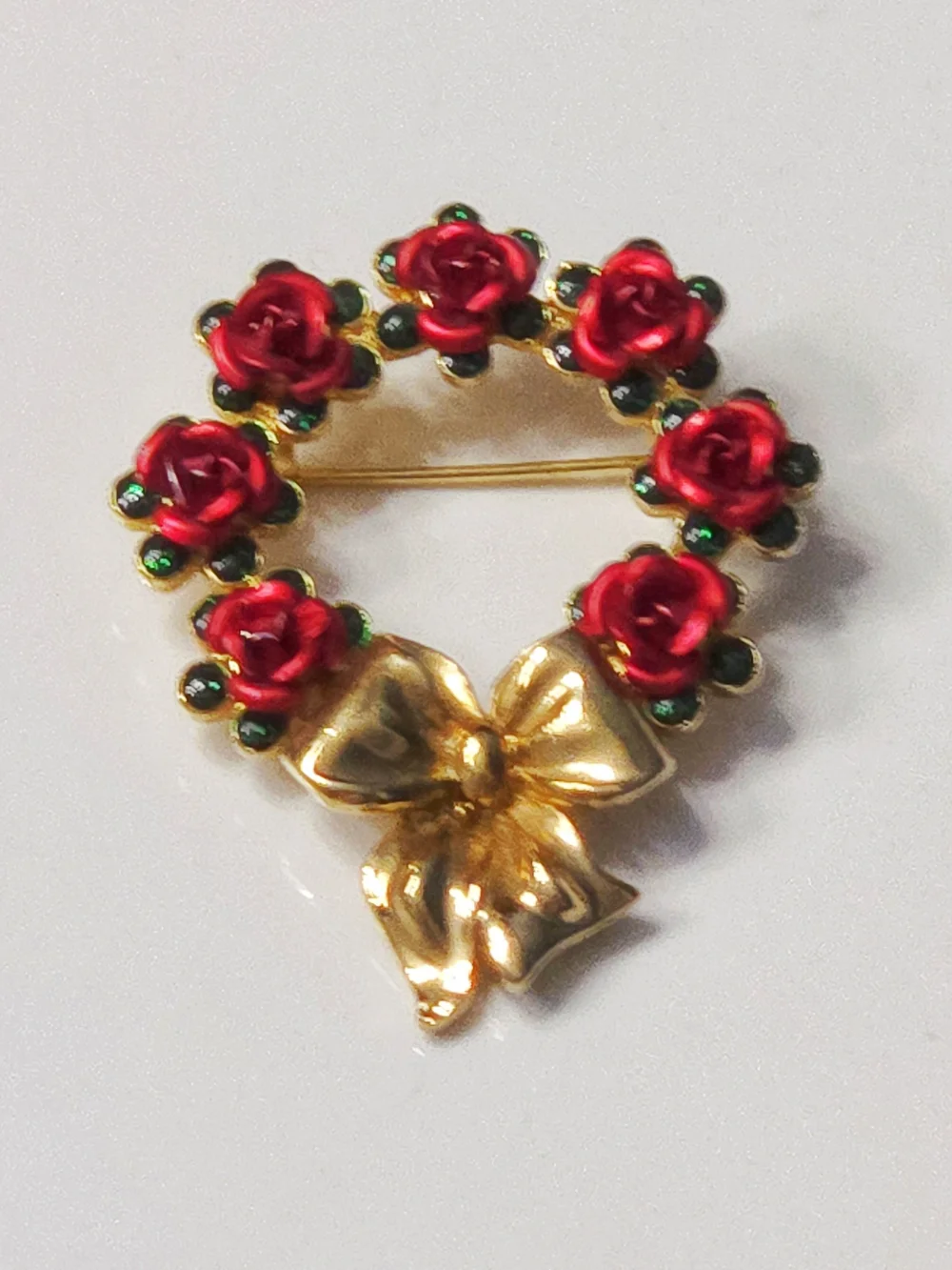 Avon Gold Bow Wreath Brooch with Red Roses and Green Accents